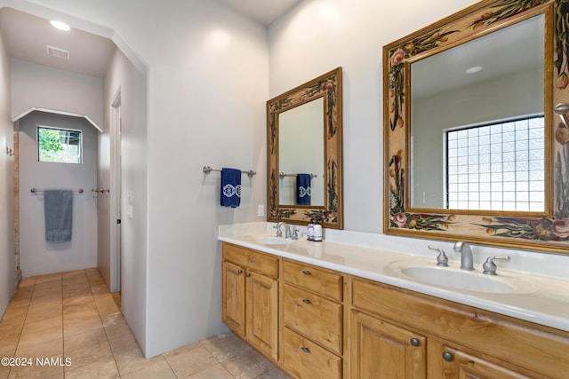 bathroom featuring vanity and tile patterned flooring