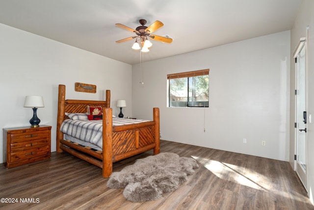 bedroom featuring dark hardwood / wood-style floors and ceiling fan