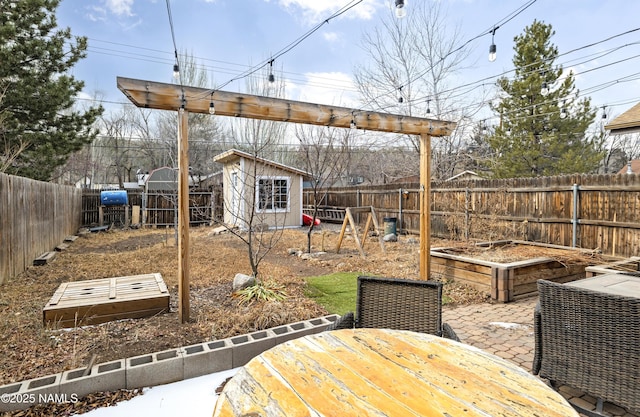 view of yard with a shed and a patio