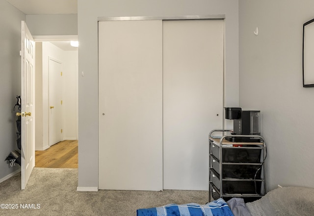 bedroom with carpet floors and a closet