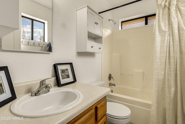 full bathroom with vanity, shower / bath combination with curtain, and toilet