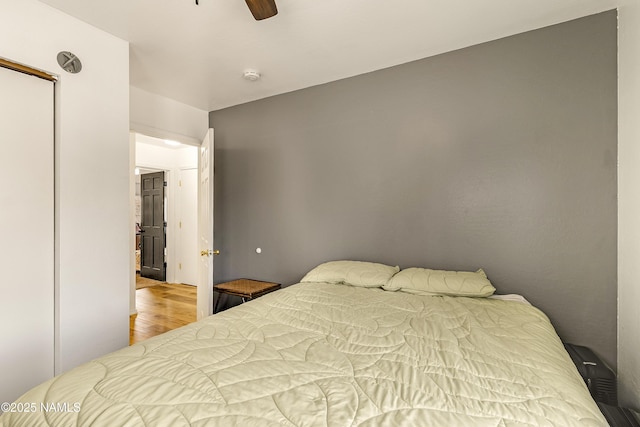 bedroom featuring hardwood / wood-style flooring and ceiling fan