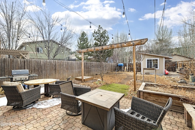 view of patio / terrace featuring a shed