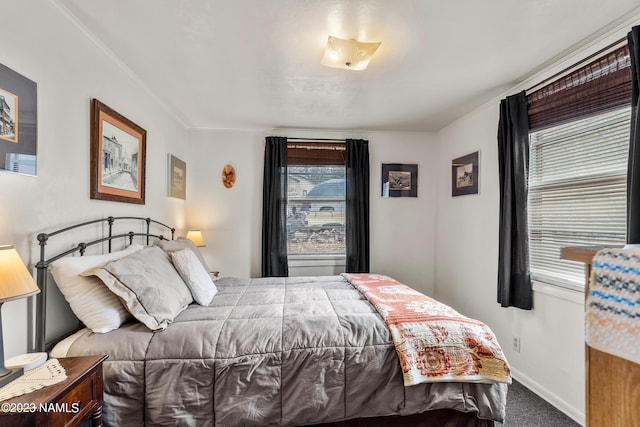 bedroom with carpet floors and ornamental molding