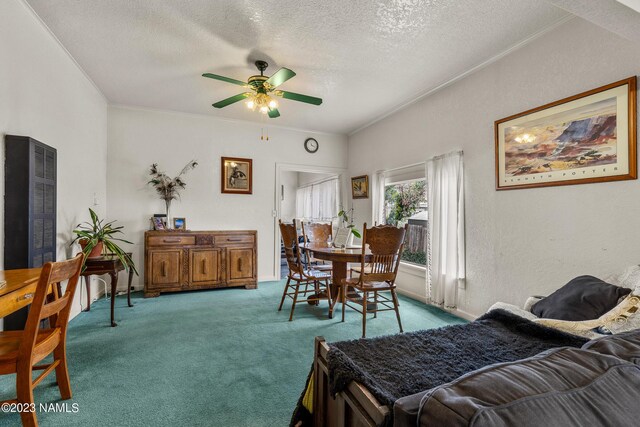 dining space featuring light carpet, a textured ceiling, ceiling fan, and crown molding