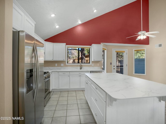 3792 E Ramble Wood Dr, Flagstaff, AZ 86004 - kitchen featuring white cabinetry, ceiling fan, visible vents, and appliances with stainless steel finishes