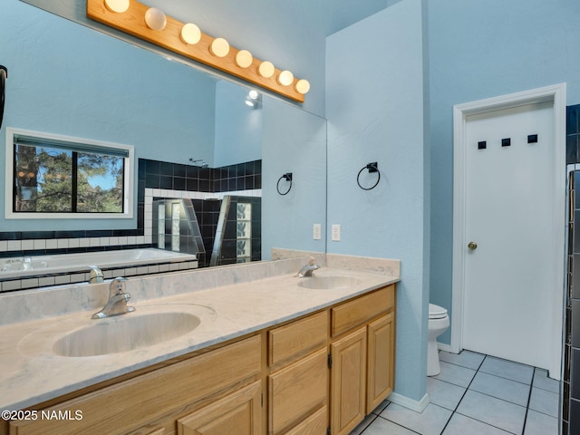3792 E Ramble Wood Dr, Flagstaff, AZ 86004 - bathroom featuring double vanity, toilet, tile patterned flooring, and a sink