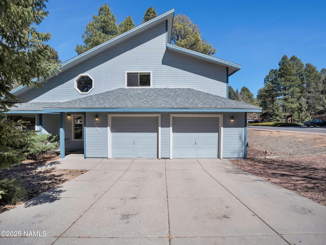 3792 E Ramble Wood Dr, Flagstaff, AZ 86004 - view of front of property with driveway, roof with shingles, and an attached garage