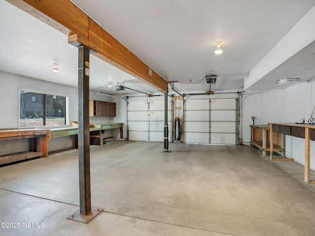 3792 E Ramble Wood Dr, Flagstaff, AZ 86004 - garage featuring a workshop area and a garage door opener