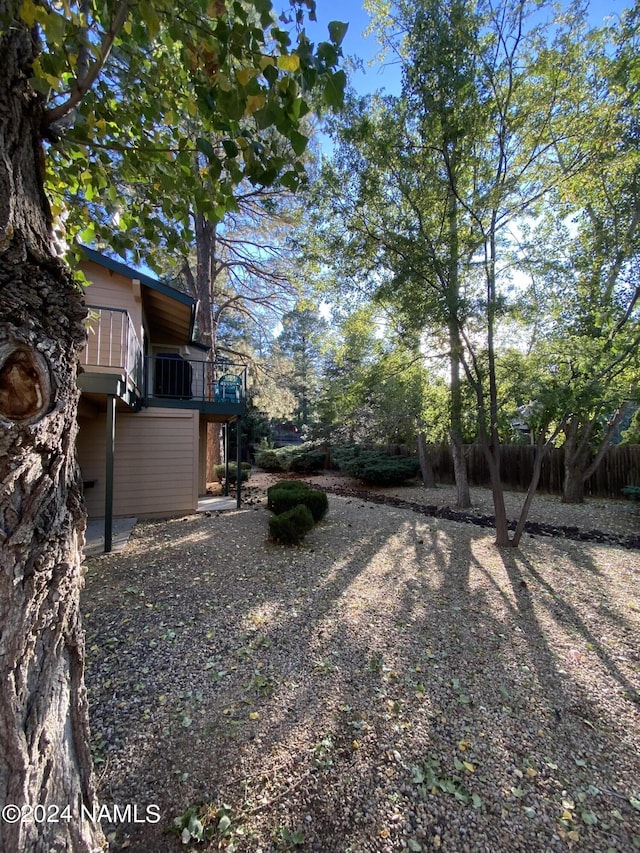 view of yard featuring a wooden deck