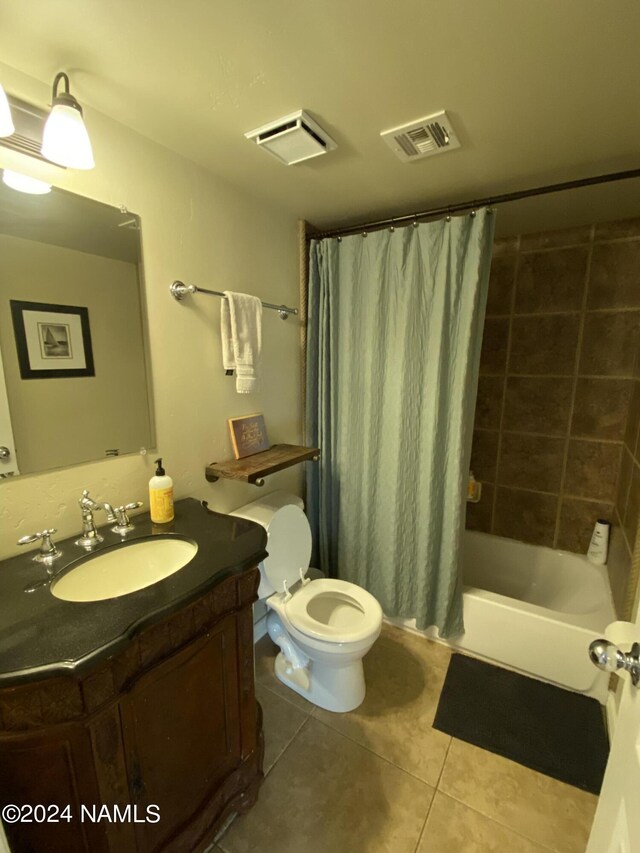 full bathroom with vanity, toilet, tile patterned floors, and shower / bathtub combination with curtain