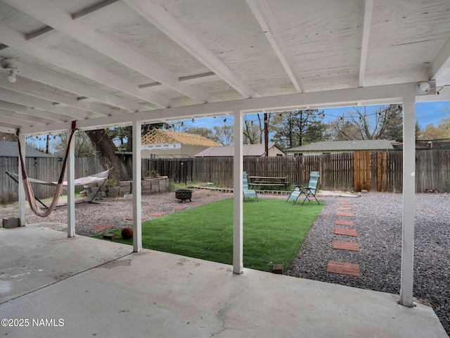 2821 N Tindle Blvd, Flagstaff, AZ 86004 - view of patio / terrace featuring a fenced backyard and a fire pit