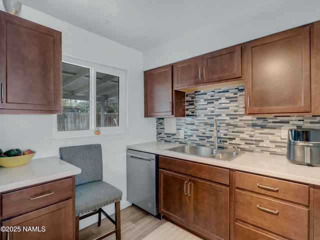 2821 N Tindle Blvd, Flagstaff, AZ 86004 - kitchen with light countertops, backsplash, a sink, and dishwasher