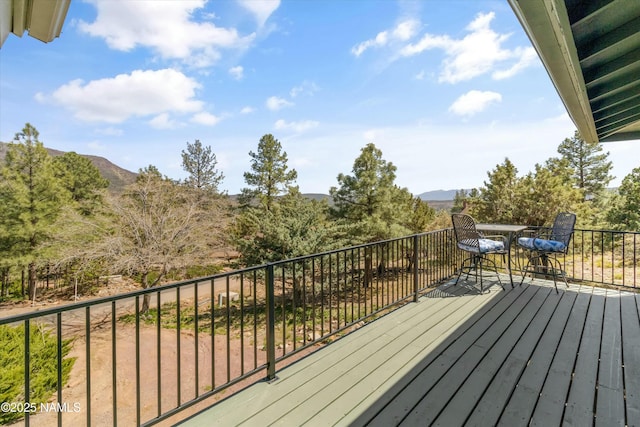 wooden terrace with a mountain view
