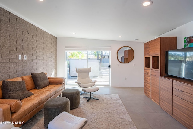 3531 E Onyx Ave, Phoenix, AZ 85028 - living room featuring light tile patterned floors, brick wall, and recessed lighting