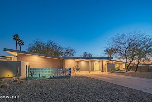 3531 E Onyx Ave, Phoenix, AZ 85028 - mid-century home featuring concrete driveway, an attached carport, and fence