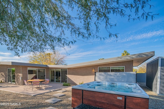 3531 E Onyx Ave, Phoenix, AZ 85028 - rear view of house featuring a patio area, brick siding, and a hot tub