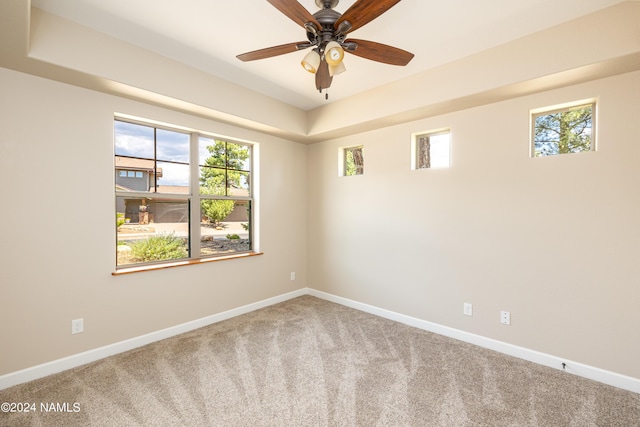 carpeted empty room with ceiling fan