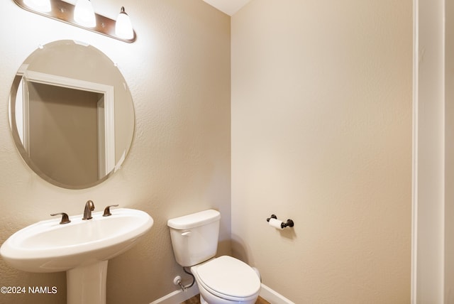 bathroom with sink and toilet