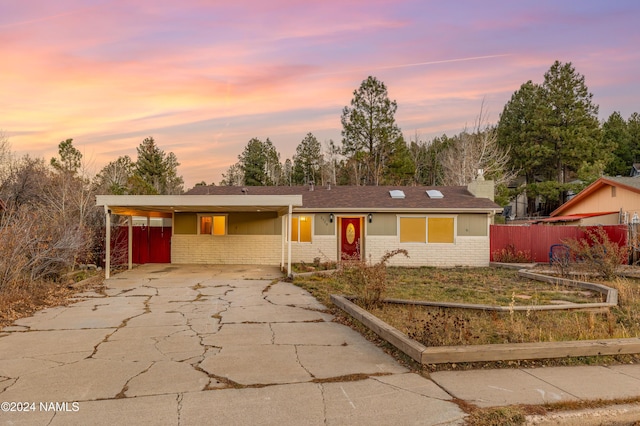 ranch-style house with a carport