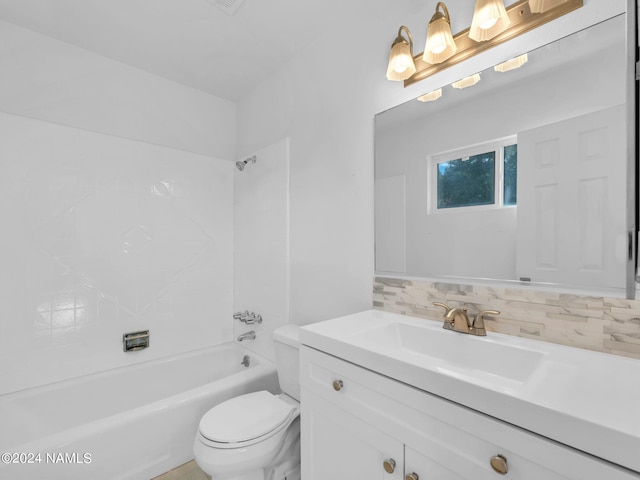 full bathroom featuring toilet, tasteful backsplash, vanity, and washtub / shower combination