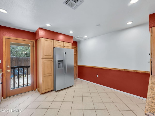 kitchen with stainless steel fridge with ice dispenser and light brown cabinets