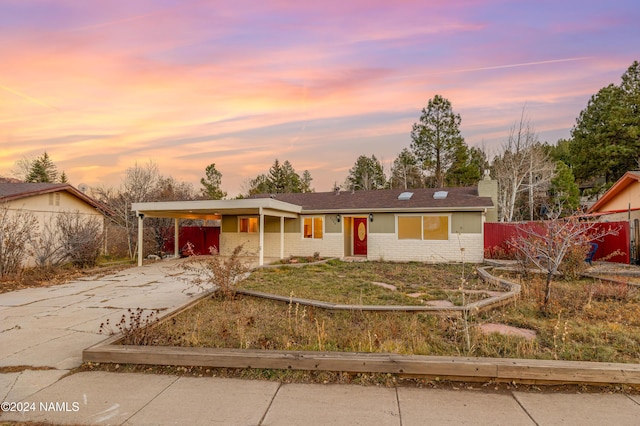 single story home with a carport