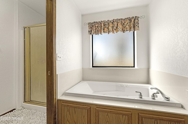 6162 Meadows Ln, Flagstaff, AZ 86004 - full bath featuring a jetted tub, a shower stall, and a textured wall