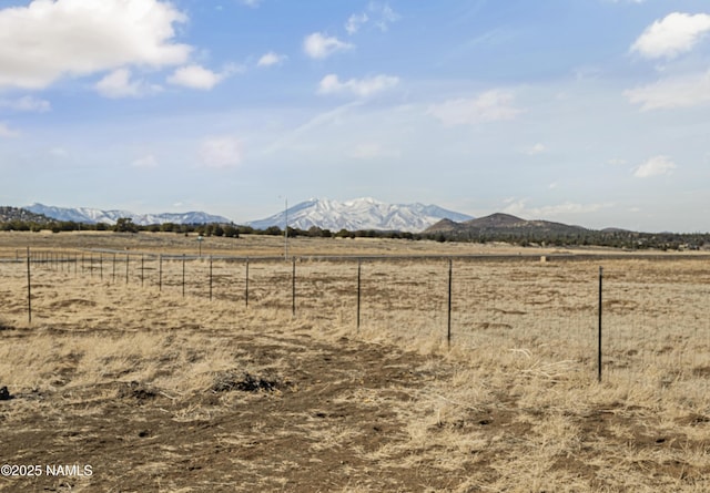 6162 Meadows Ln, Flagstaff, AZ 86004 - view of yard with fence, a rural view, and a mountain view