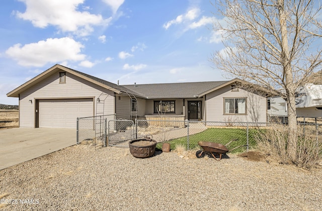 6162 Meadows Ln, Flagstaff, AZ 86004 - ranch-style home featuring a gate, driveway, roof with shingles, a garage, and a fenced front yard