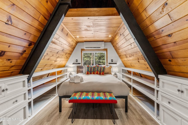 bedroom featuring vaulted ceiling, wood finished floors, a wall unit AC, and wood ceiling