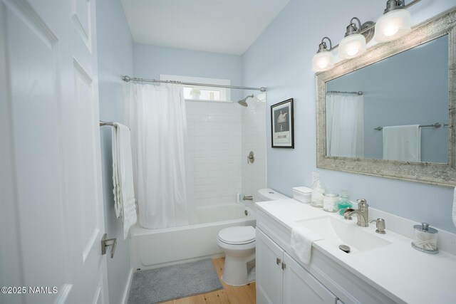 full bathroom with toilet, vanity, shower / tub combo with curtain, and wood finished floors