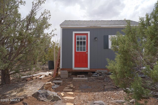 view of outbuilding featuring an outdoor structure and entry steps