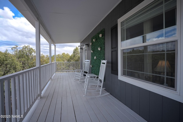 wooden terrace featuring a porch