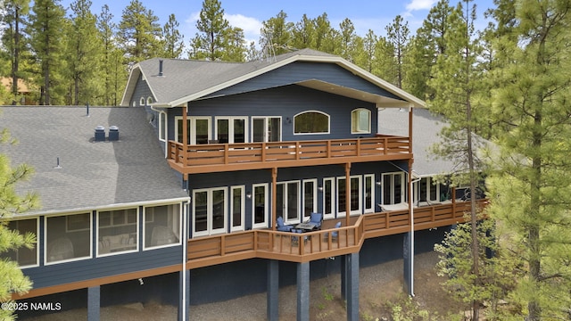 1430 E Puma Pl Unit F, Munds Park, AZ 86017 - rear view of property with a shingled roof, a wooden deck, and a balcony