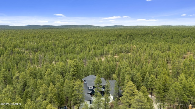1430 E Puma Pl Unit F, Munds Park, AZ 86017 - drone / aerial view of a heavily wooded area and mountains