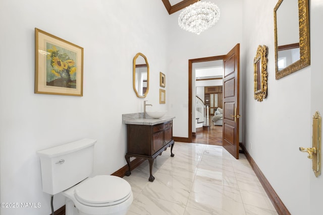 1430 E Puma Pl Unit F, Munds Park, AZ 86017 - bathroom with marble tiled floors, vanity, a chandelier, and a high ceiling