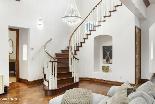 1430 E Puma Pl Unit F, Munds Park, AZ 86017 - staircase with a towering ceiling and a chandelier