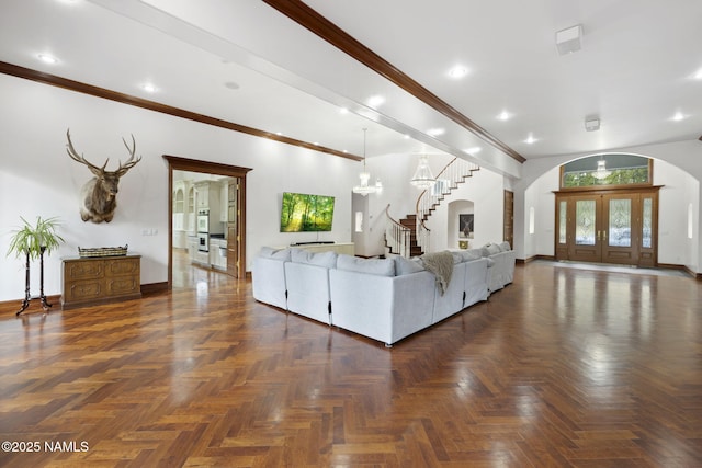 1430 E Puma Pl Unit F, Munds Park, AZ 86017 - living room with stairway, arched walkways, recessed lighting, ornamental molding, and a chandelier