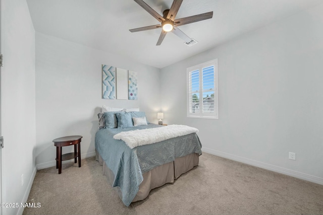 bedroom featuring ceiling fan, baseboards, visible vents, and light carpet