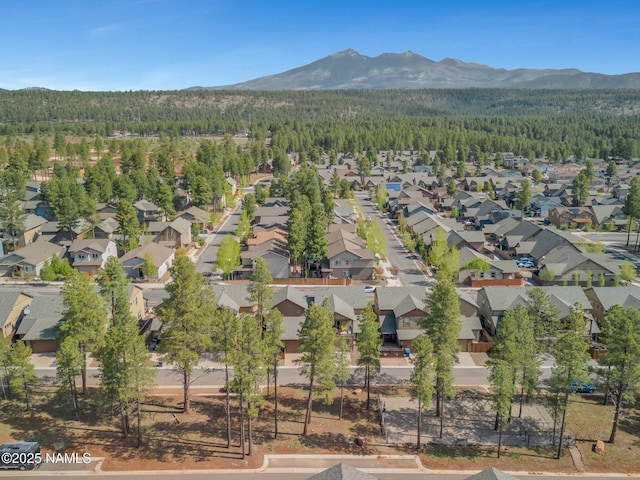 bird's eye view with a mountain view, a forest view, and a residential view