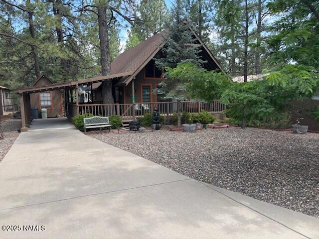 17119 S Deer Run Rd, Munds Park, AZ 86017 - view of front facade with a porch
