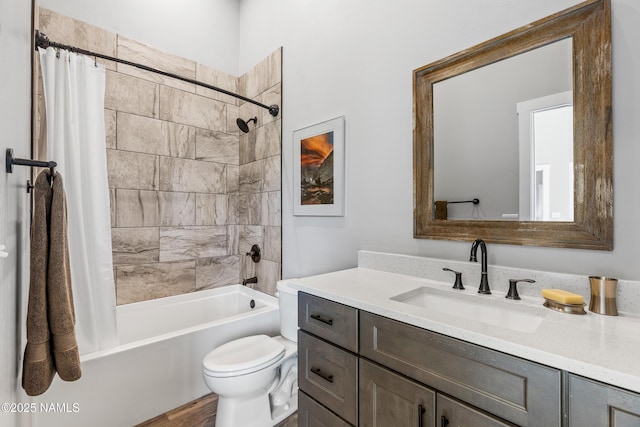 bathroom featuring vanity, toilet, and shower / bath combo with shower curtain