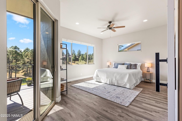 bedroom with access to exterior, recessed lighting, baseboards, and wood finished floors