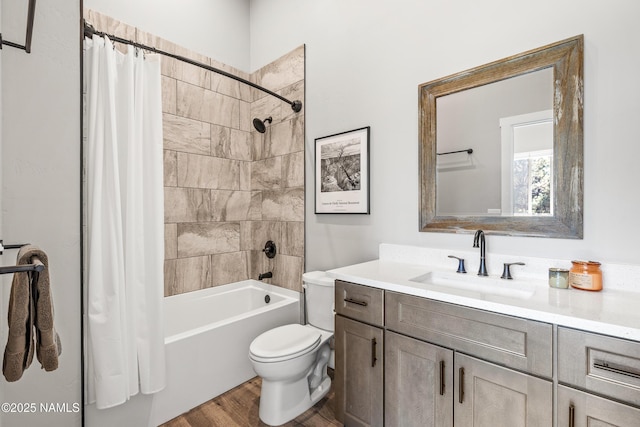 bathroom with toilet, shower / bath combo, wood finished floors, and vanity