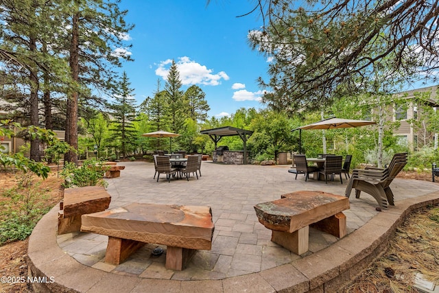 1401 N 4th St Unit 228, Flagstaff, AZ 86004 - view of patio / terrace featuring outdoor dining area and a gazebo