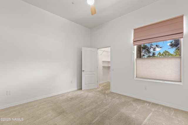 1401 N 4th St Unit 228, Flagstaff, AZ 86004 - unfurnished bedroom featuring carpet, a spacious closet, baseboards, a closet, and ceiling fan