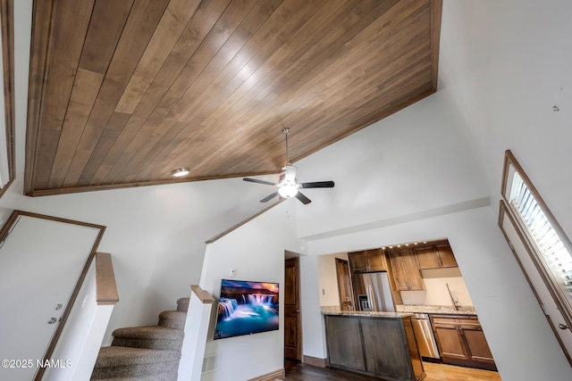 1200 S Riordan Ranch St Unit 36, Flagstaff, AZ 86001 - living room featuring high vaulted ceiling, a ceiling fan, wooden ceiling, wood finished floors, and stairs