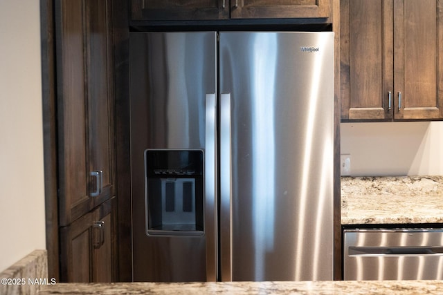 1200 S Riordan Ranch St Unit 36, Flagstaff, AZ 86001 - kitchen with light stone counters, dark brown cabinetry, and stainless steel appliances