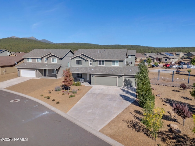 4580 Centaurus Rd, Bellemont, AZ 86015 - view of front facade with driveway, roof with shingles, a residential view, and a garage